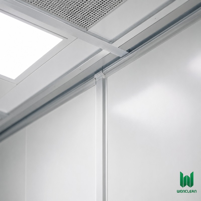 Close-up engineering view of clean room sandwich panel and ceiling grid joint