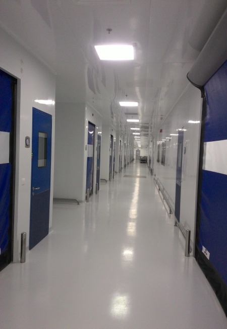Sterile cleanroom corridor with cleanable wall panels windows doors and ceiling supply interfaces